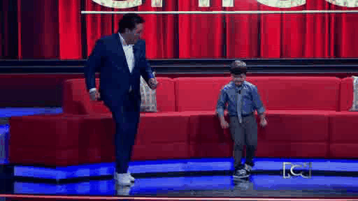 SuperNachin en pleno reality de RCN enseñando a Andrés López cómo se baila la Champeta